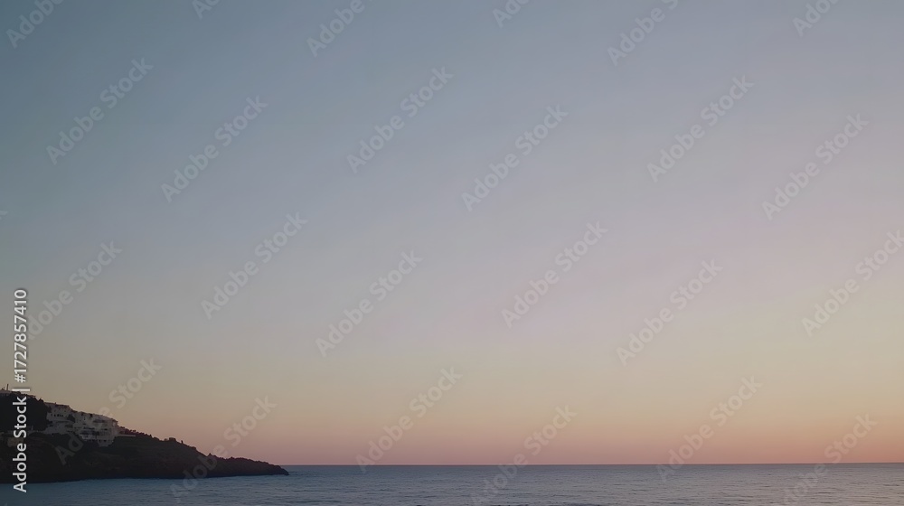 Fototapeta premium Serene Coastal Sunset Landscape, Calm Sea, Pink Sky, Hillside Homes