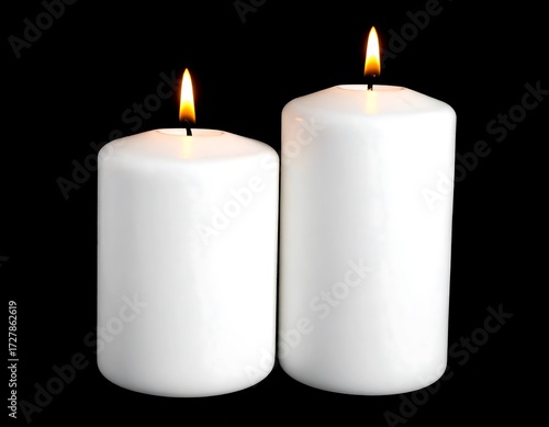 Two white candles, different sizes, burning
