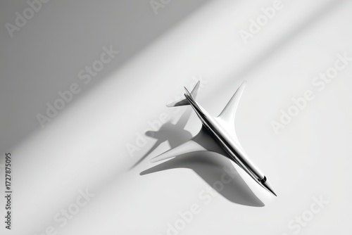 Sleek Supersonic Jet Model Casting a Dramatic Shadow in Stark Diagonal Light.