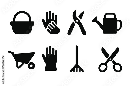 Garden Tool Icons. Solid, filled icon set of garden harvesting tools: basket, gloves, pruning shears, watering can, wheelbarrow, gloves, rake, garden scissors.