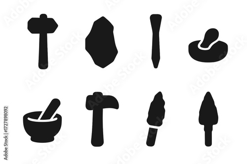 Geological Stone Tools Icons. Solid, filled icon set of geological stone tools: stone hammer, flint, chisel, grinding stone, mortar and pestle, stone axe,