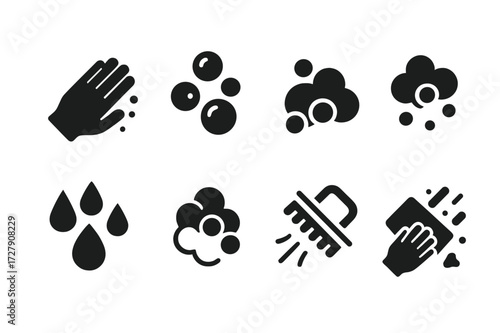 Scrubbing Icon Set. Solid, filled icon set of scrubbing actions: hand scrubbing, scrubbing bubbles, foam, water droplets, soap suds, scrub brush motion,