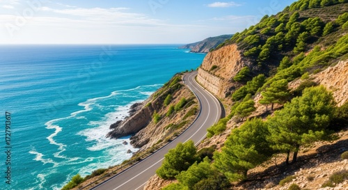 Wallpaper Mural Scenic coastal road winds along a cliffside offering stunning ocean views and lush greenery Torontodigital.ca