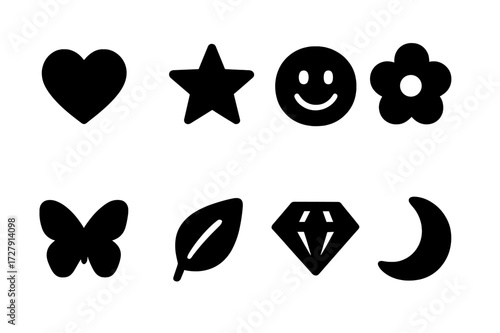 Charming Black Icon Set. Solid, filled icon set of charm symbols: heart, star, smiley face, flower, butterfly, leaf, diamond, crescent moon. Solid, filled