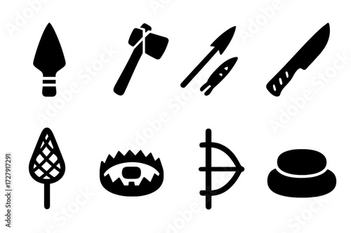 Tribal Tool Icons. Solid, filled icon set of tribal tools: spearhead, axe, bow and arrow, knife, fishing net, trap, firestarter, grinding stone. Solid, filled
