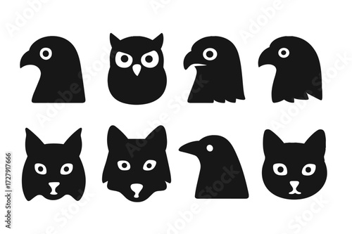 Black Animal Icons. Solid, filled icon set of watcher animals: falcon, owl, hawk, eagle, lynx, wolf, crow, cat. Solid, filled icons in only black color. All