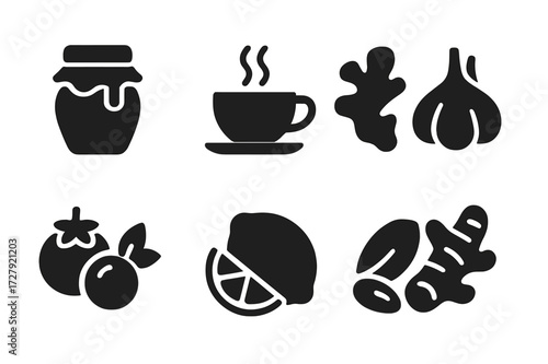 Healing Foods Icons. Solid, filled icon set of healing foods: honey, green tea, ginger, garlic, berries, nuts, lemon, turmeric root. Solid, filled icons in