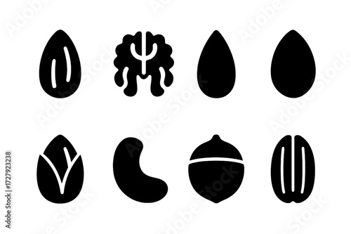 Nut and Seed Icons. Solid, filled icon set of hand-picked nuts and seeds: almond, walnut, sunflower seed, pumpkin seed, pistachio, cashew, hazelnut, pecan.