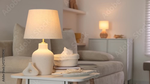 Wallpaper Mural Stylish lamp, decor and book on white table indoors, camera moving left Torontodigital.ca