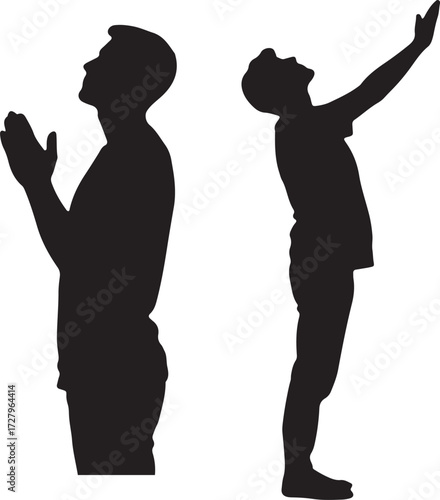 Silhouettes of People Praying. Two silhouetted figures standing in prayer, conveying a sense of devotion and spirituality.