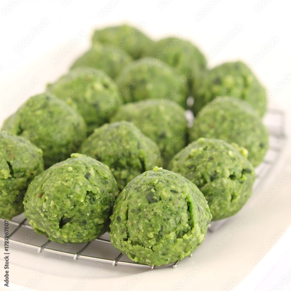 Fototapeta premium Round, green food balls on wire rack