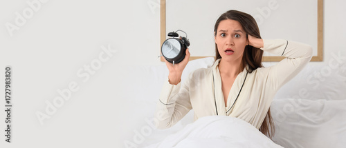 Overslept young woman with ...