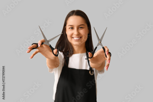 Female hairdresser with sci...
