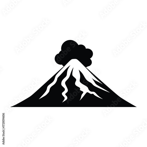 Erupting black volcano shows billowing smoke against a stark white background beautifully and starkly