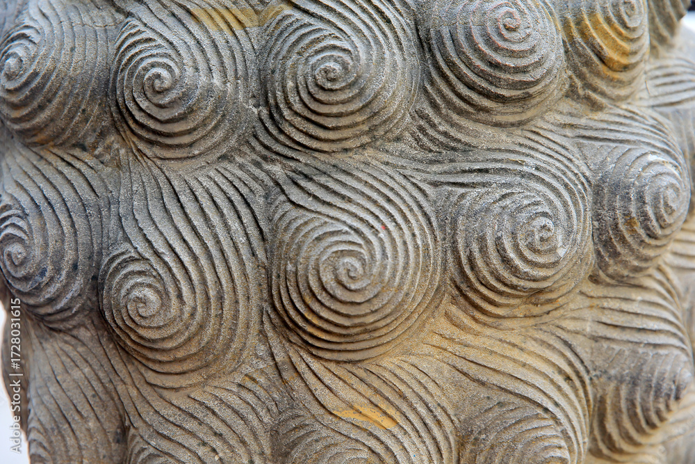 Fototapeta premium Vintage ornament on the stone. Close-up seamless texture. Stone texture. Embossed pattern.