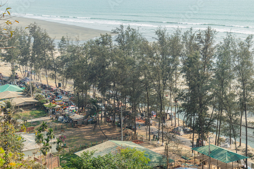 The lush greenery and peaceful waves of Cox’s Bazar beach, Bangladesh, create a tranquil and scenic environment.