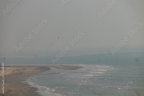 ranquil beauty of the beach in Cox’s Bazar, with clear skies and gentle waves, Bangladesh.