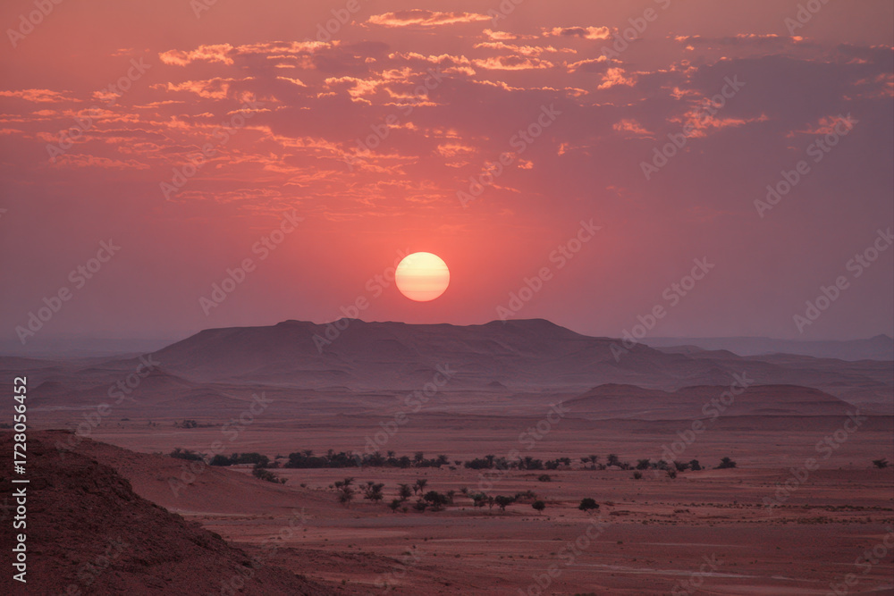 Fototapeta premium Blurred desert horizon at sunset with soft orange glow and surreal minimal background