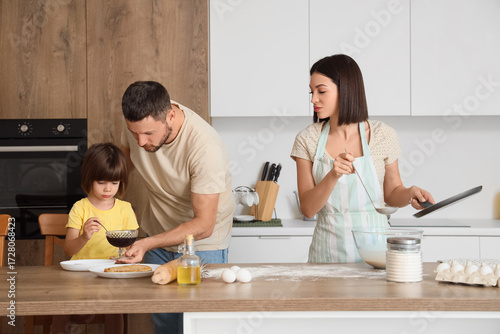 Happy family making pancake...