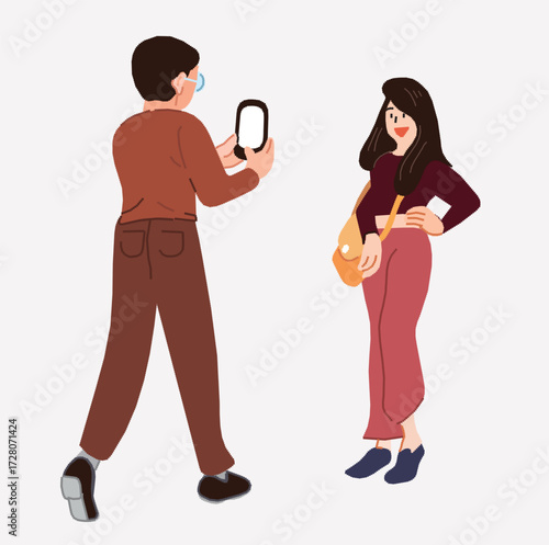A man is using his mobile phone to take a picture of a woman.