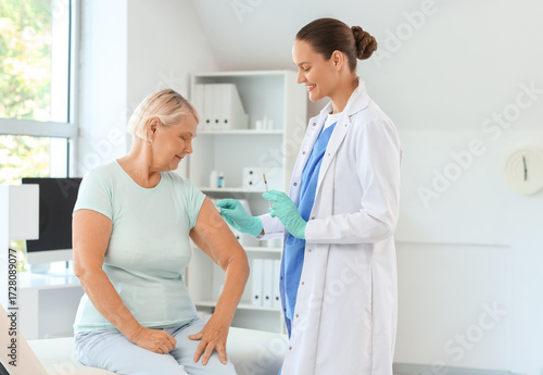 Female doctor vaccinating s...