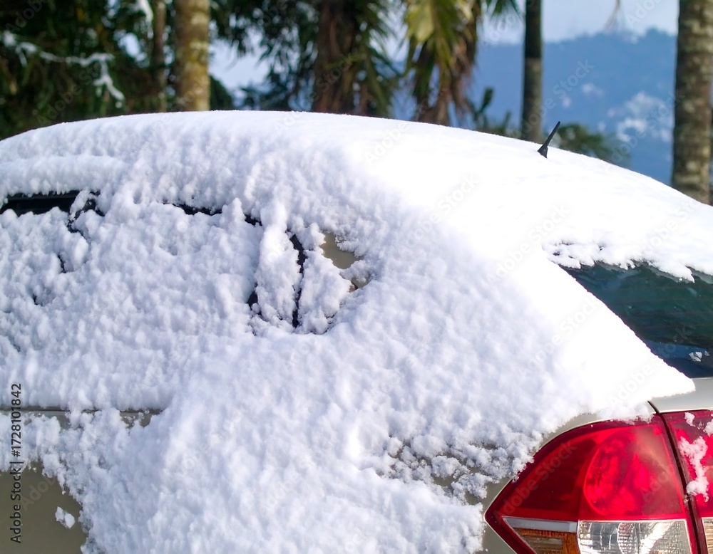 Fototapeta premium Snowy car parked outdoors
