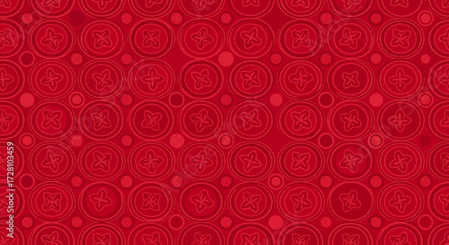 A vibrant red seamless pattern featuring intricate circular motifs and smaller dots, creating a decorative and traditional background.