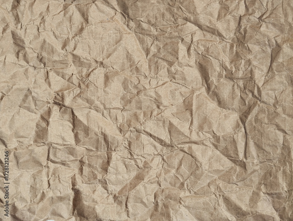 Fototapeta premium Abstract crumpled brown paper texture background. Copy space 