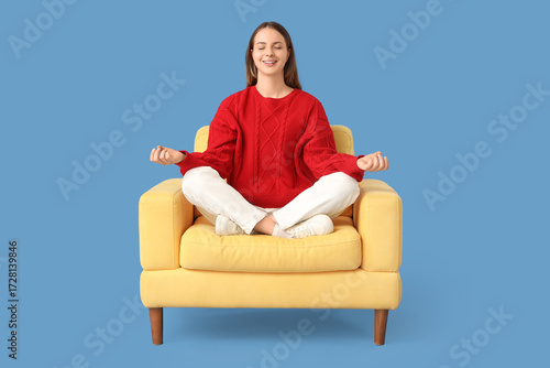 Young woman meditating in y...