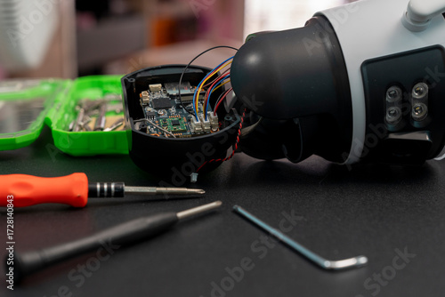 Repairing a wireless CCTV camera on a black background