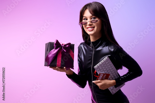 Young woman with gift and c...