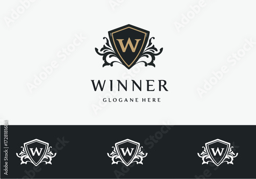 Elegant Winner Logo Design with Shield and Flourishes for Branding.
