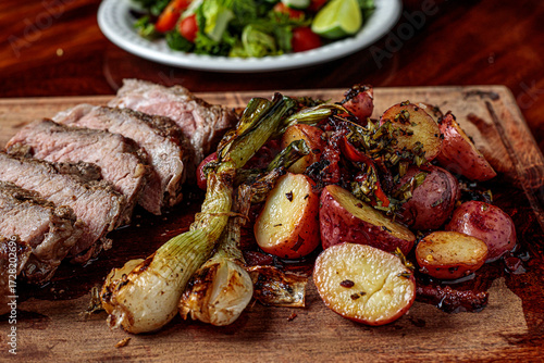 Picaña steak, accompanied by sautéed cambray potatoes and chimichurri