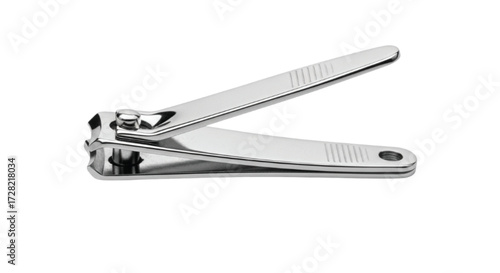 Shiny stainless steel nail clippers isolated on a clean white background, representing personal grooming and hygiene.