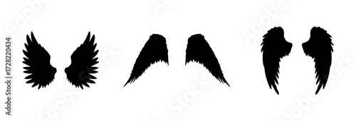A Vector set of linear heraldic Icarus wings. Collection of black angel or bird wings with feathers alignment. Design element for tattoo, logo or mascot. Birds Wings for background vector for logo.