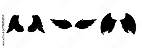 A Vector set of linear heraldic Icarus wings. Collection of black angel or bird wings with feathers alignment. Design element for tattoo, logo or mascot. Birds Wings for background vector for logo.