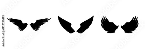 A Vector set of linear heraldic Icarus wings. Collection of black angel or bird wings with feathers alignment. Design element for tattoo, logo or mascot. Birds Wings for background vector for logo.