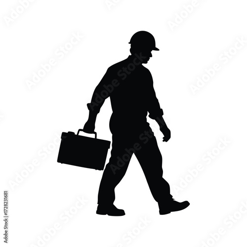 Silhouette of a worker with hardhat and briefcase walking on white backdrop, construction worker carrying toolbox silhouette vector illustration
