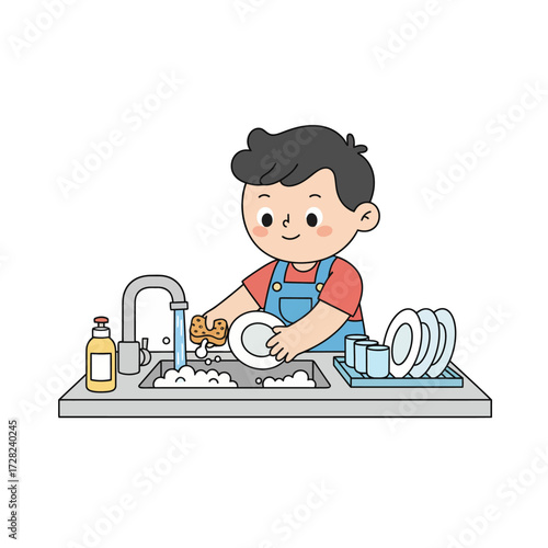 A cheerful young boy wearing an apron happily washes dishes in the kitchen sink with soap and a sponge.