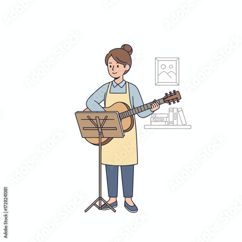 A woman in an apron practices playing an acoustic guitar, reading music from a stand at home.