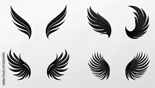 A set of four different pairs of stylized black angel or bird wings isolated on a light gray background.