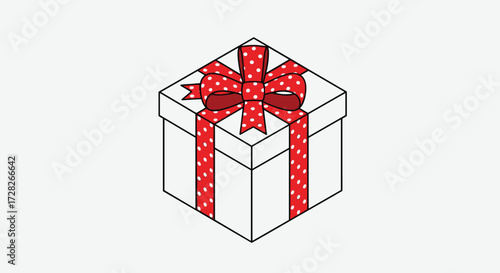A beautifully wrapped gift box tied with a festive red ribbon featuring a polka dot pattern.