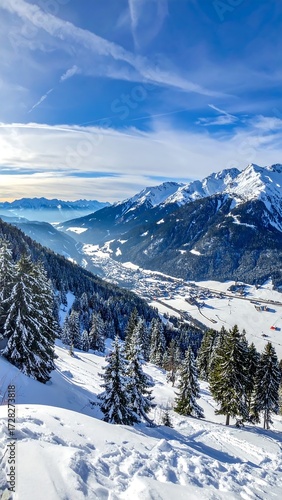 Wallpaper Mural Snowy mountain valley vista, sunlit peaks, coniferous forest, winter scene Torontodigital.ca