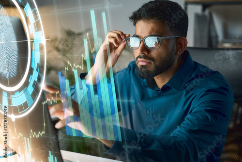 Analyst Studying Data Visualizations On Futuristic Dashboard With Holographic Charts And Fingerprint Interfaces Displays