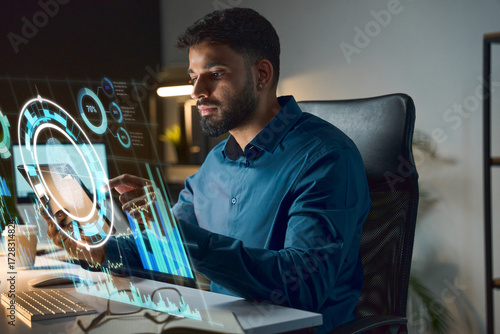 Tech Professional Analyzing Data On Futuristic Holographic Interface At A Desk In Modern Office Space