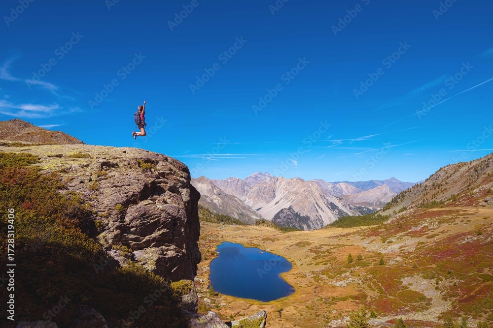 Obraz premium Woman enjoy hiking in french alps in autumn