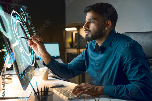 Focused Tech Professional Interacts With Futuristic Holographic Display While Working On Desktop