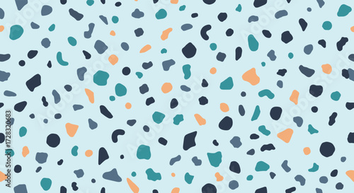 A light blue background with a scattered pattern of irregularly shaped flecks in shades of teal navy and peach.
