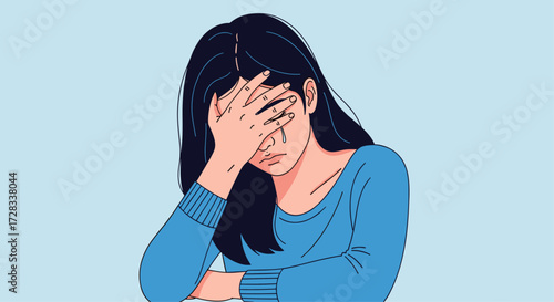 Woman with hand covering her face expressing frustration or sadness.