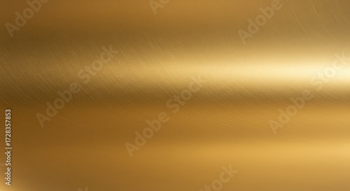 Stunning brushed gold metal texture with warm light reflection, perfect for luxurious backgrounds, elegant designs, and sophisticated branding projects seeking a premium aesthetic.